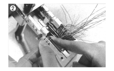 2. Clamp the cable and terminate each signal wire to the protector.